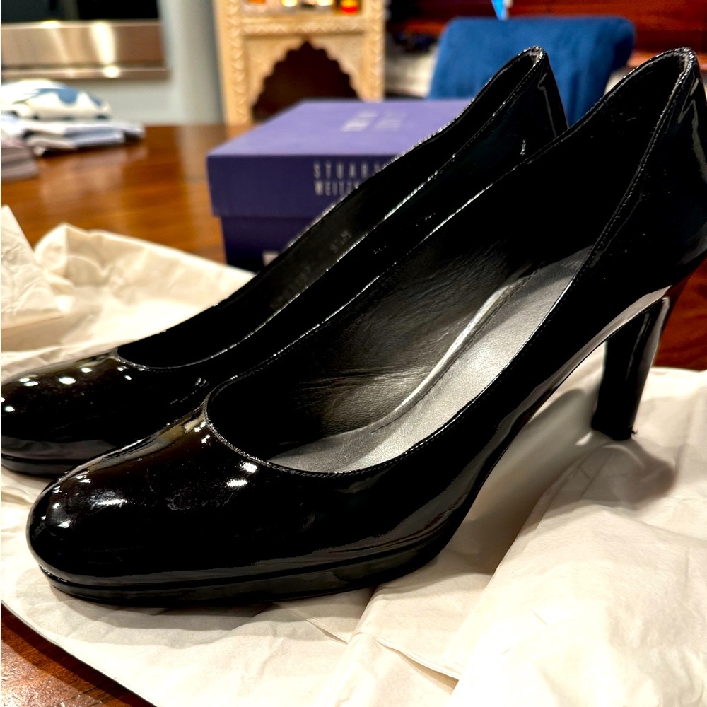 Minimally used Stuart Weitzman black patent leather heels.